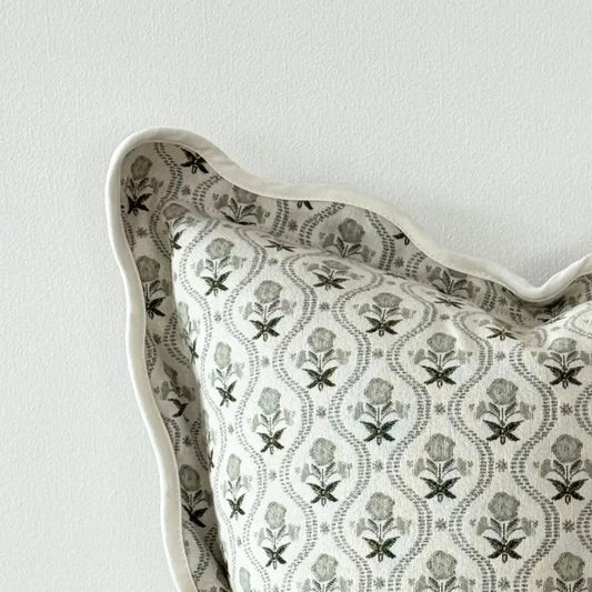 Decorative pillow with floral pattern on a plain background