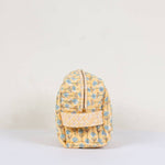 Load image into Gallery viewer, Yellow floral-patterned washbag on a light beige background

