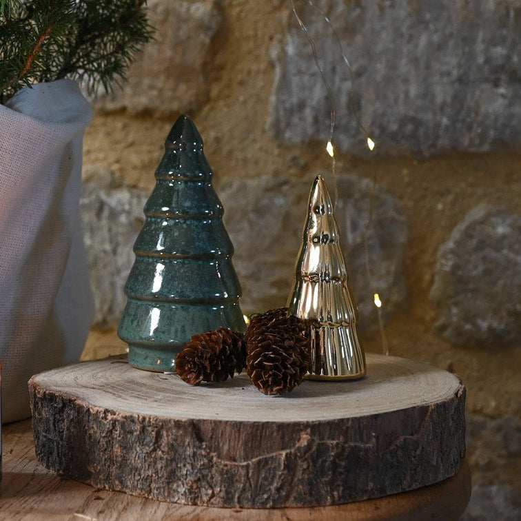 Decorative trees against a stone wall 