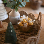 Load image into Gallery viewer, Decorative setting with a vase of greenery, small bowl with decorative items, and a candle on a textured surface.
