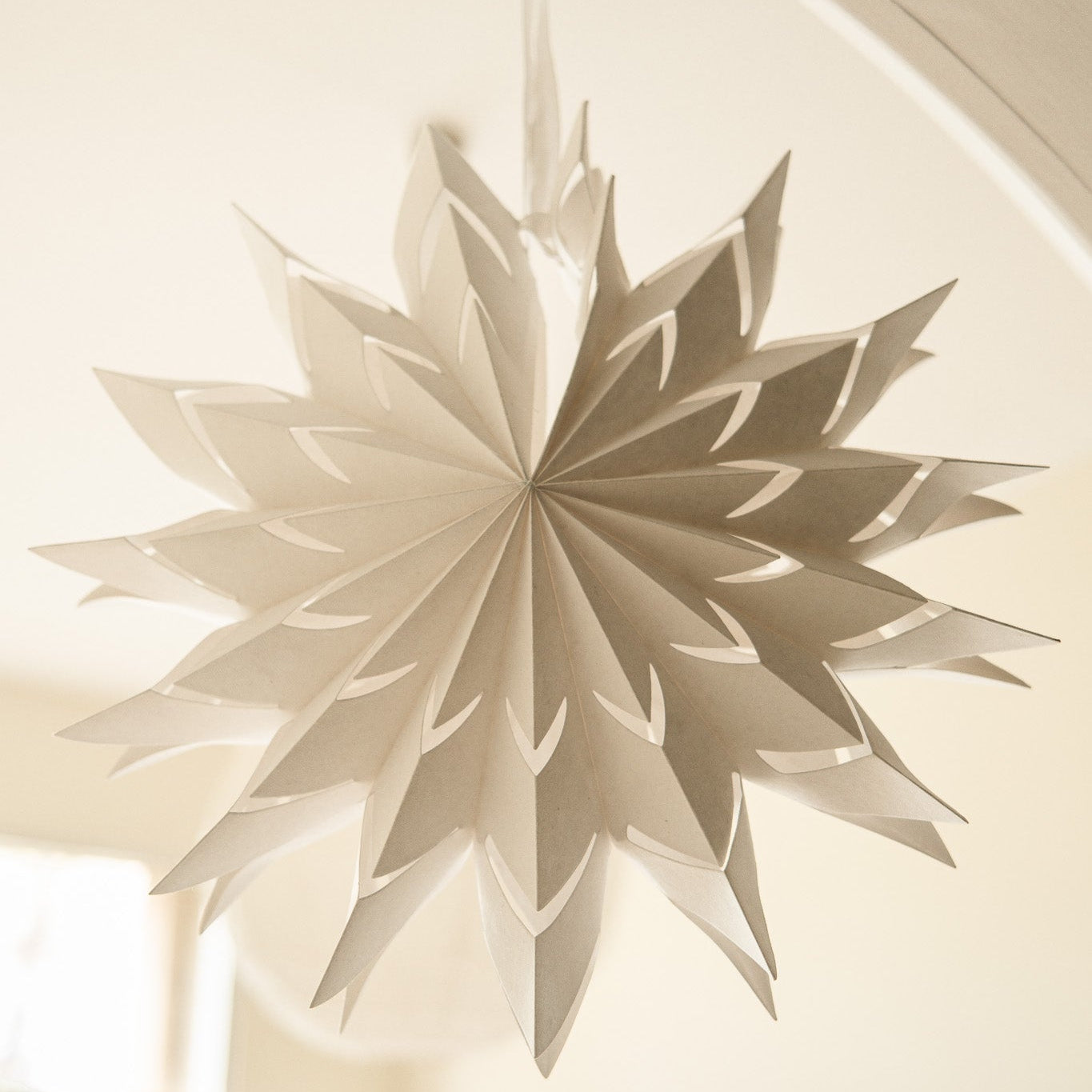 Decorative paper star hanging on a ceiling