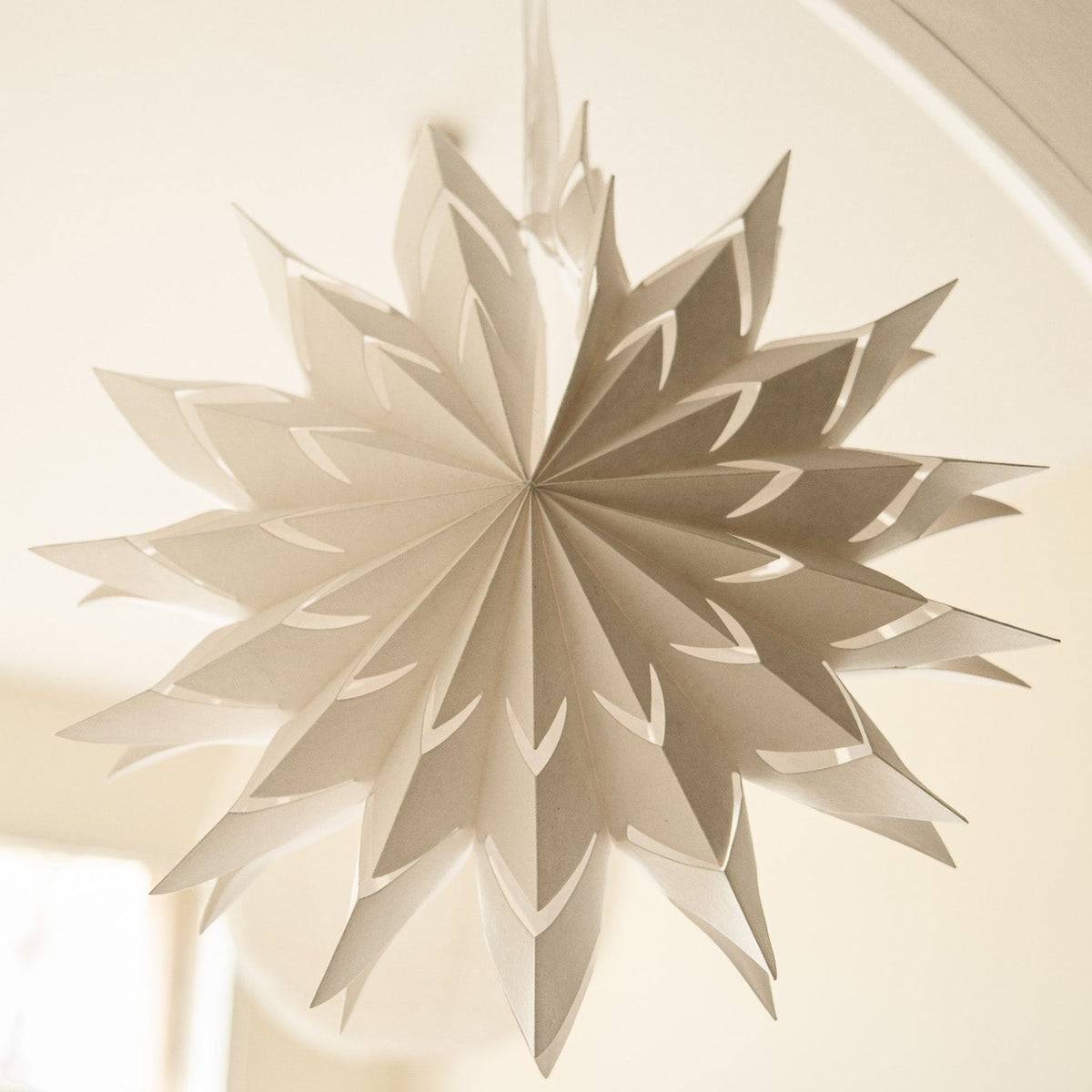 Decorative paper star hanging on a ceiling