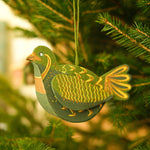 Load image into Gallery viewer, Decorative green bird ornament hanging on a Christmas tree
