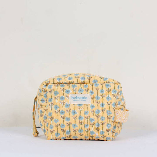 Yellow floral patterned washbag with 'bohemia' branding on a white background