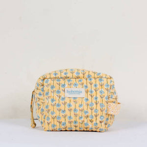 Yellow floral patterned washbag with 'bohemia' branding on a white background