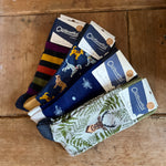 Load image into Gallery viewer, Set of men&#39;s socks with various designs on a wooden surface
