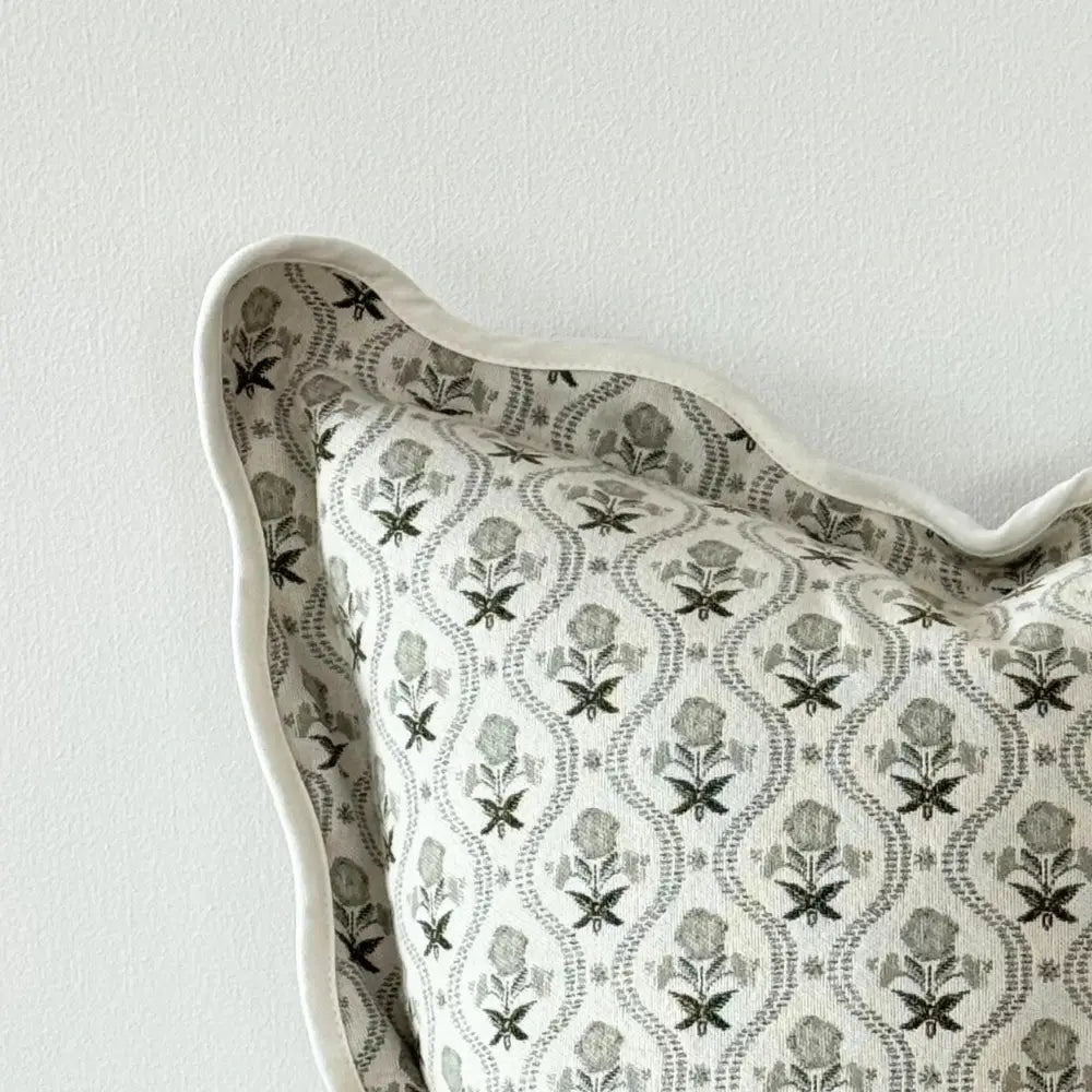 Decorative pillow with floral pattern on a plain background