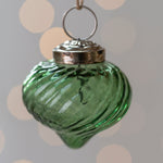 Load image into Gallery viewer, Green glass ornament with silver top on a polka dot background
