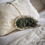 Load image into Gallery viewer, Green quilted eye mask on a white pillow
